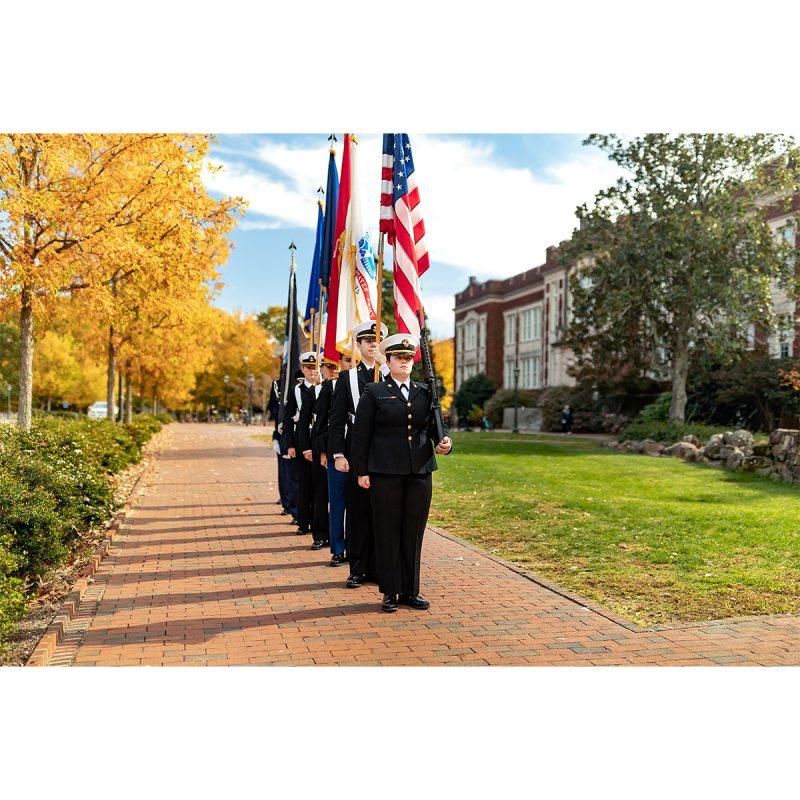 Members of Carolina ROTC hold flags during a Veterans Day ceremony outside Memorial Hall.